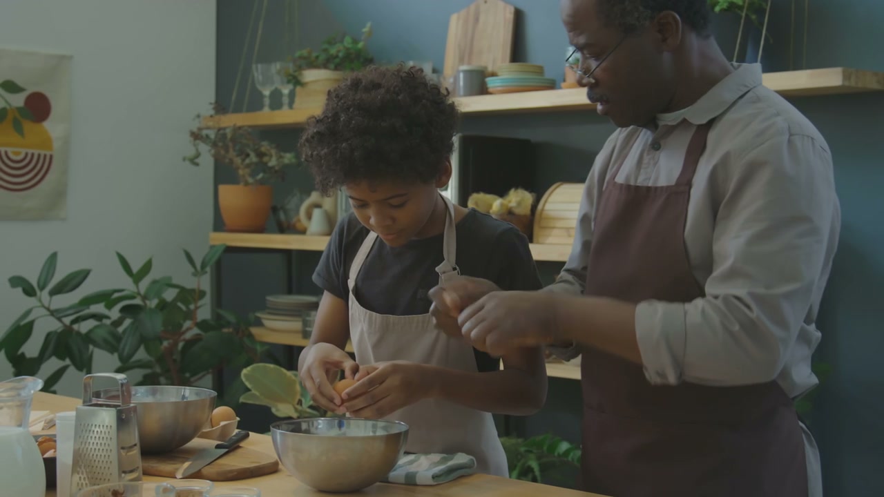 Grandfather Teaching Grandson to Cook