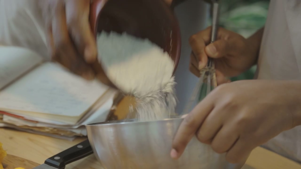 Close Up of Parent and Child Hands Baking