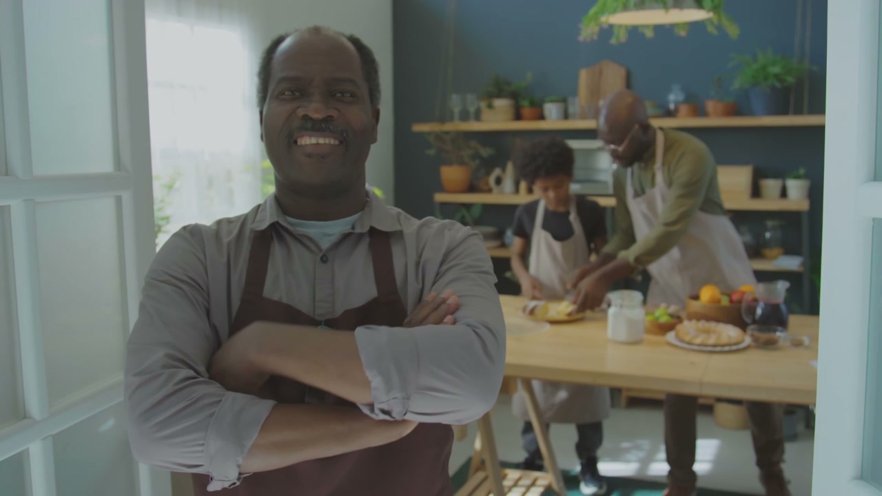 Happy Grandfather Smiling in Home Kitchen