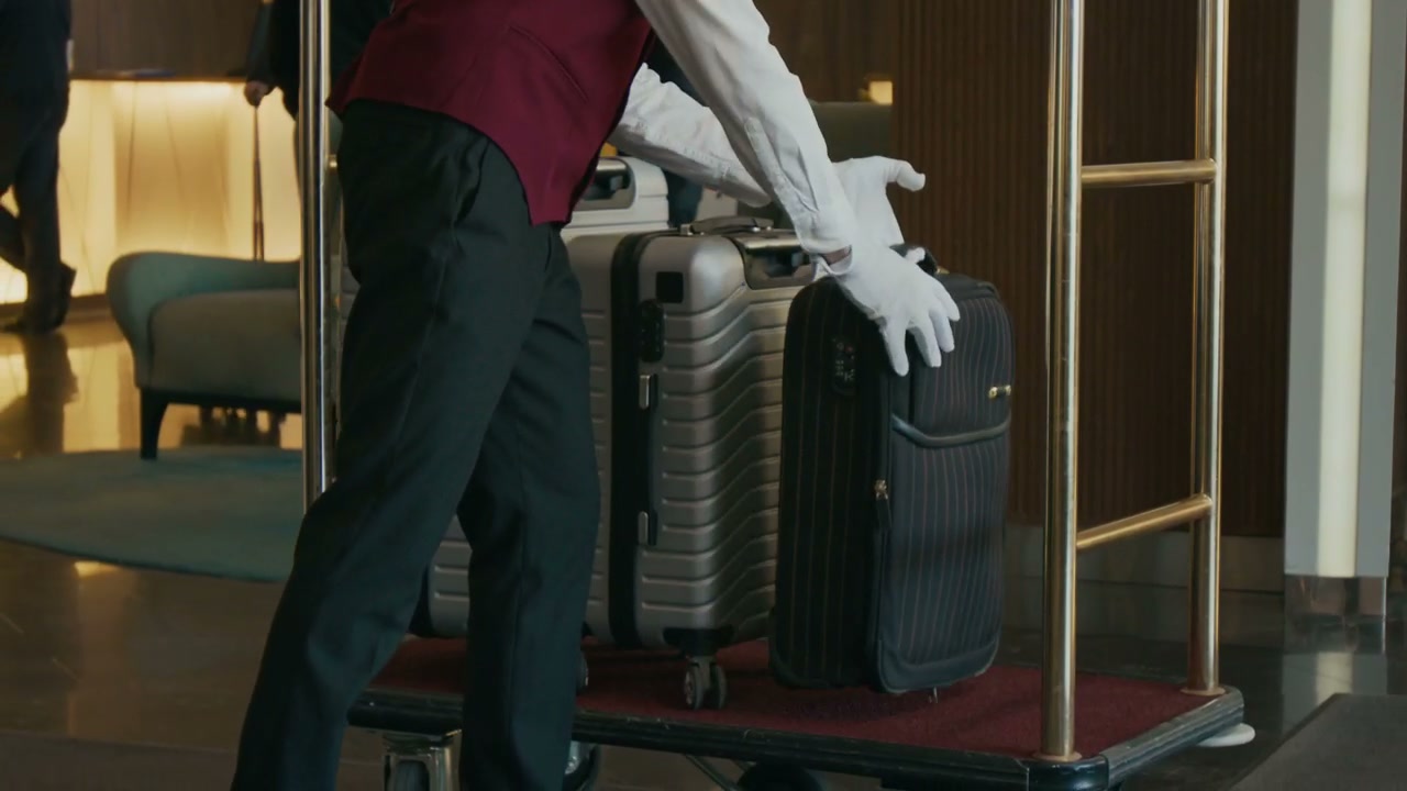 Hotel Bellhop Stacking Luggage