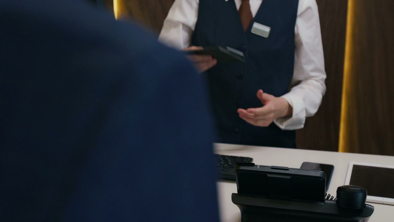 Close-up Hotel Guest Receiving Key Card