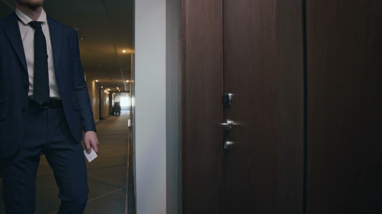 Businessman Enters Hotel Room