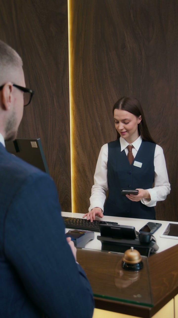 Hotel Check-in at Reception Desk