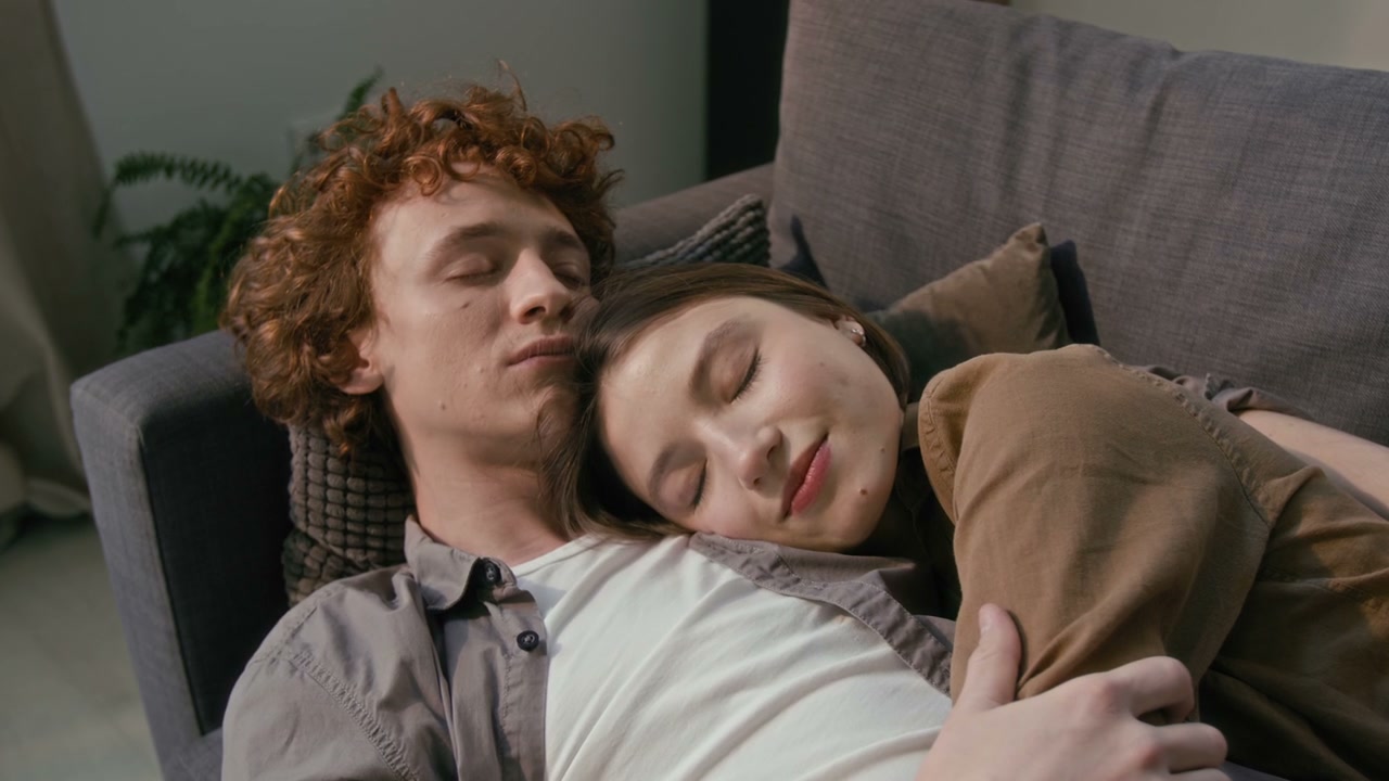 Romantic Couple Cuddling on Sofa