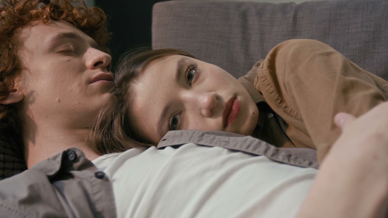 Cozy Couple Cuddling on Couch
