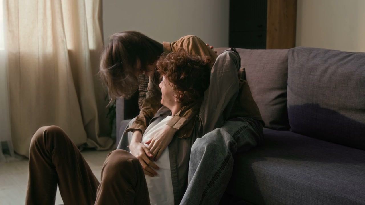 Young Couple Embracing Playfully at Home