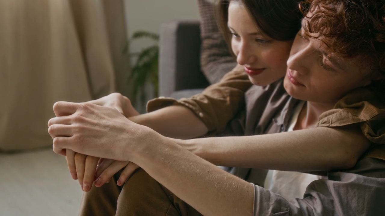 Romantic Couple Cuddling At Home