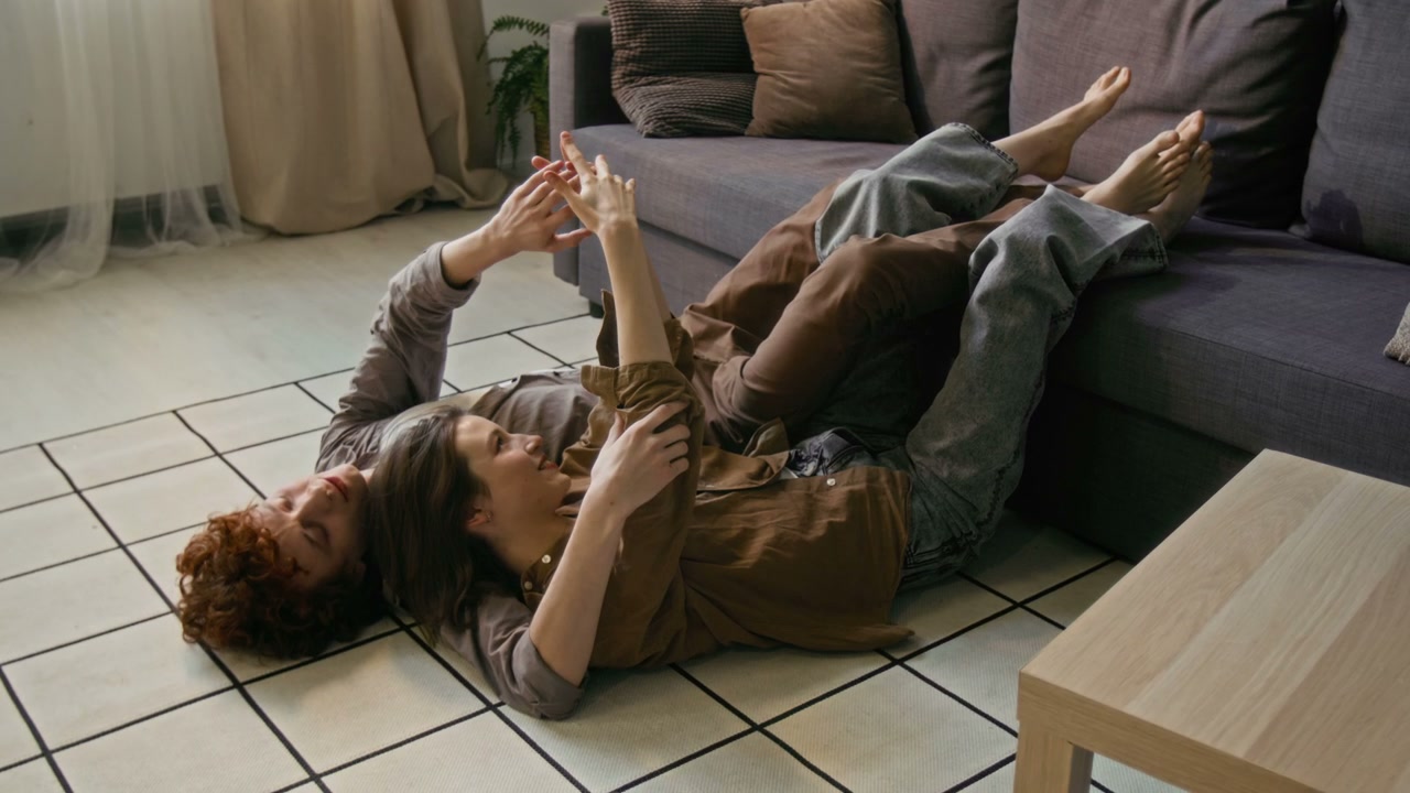 Romantic Couple Cuddling on Floor