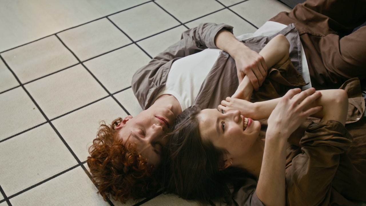 Romantic Couple Cuddling on Floor