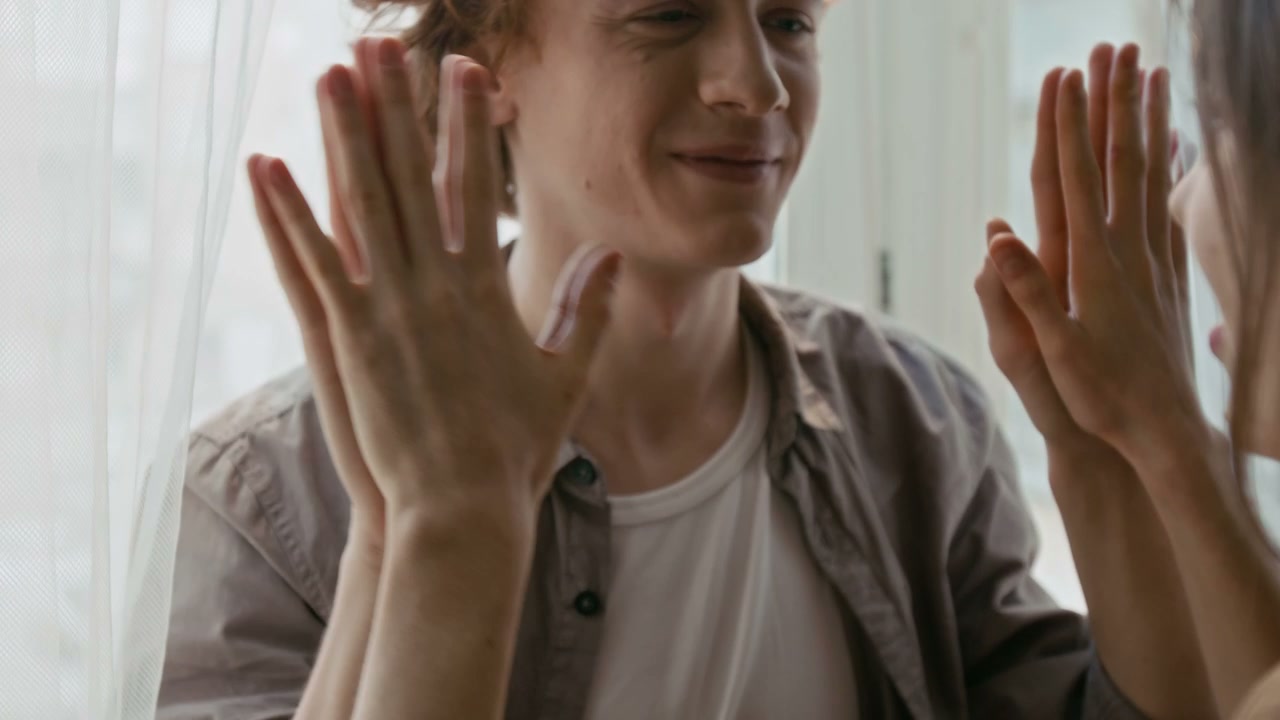 Happy Couple Touching Palms Playfully