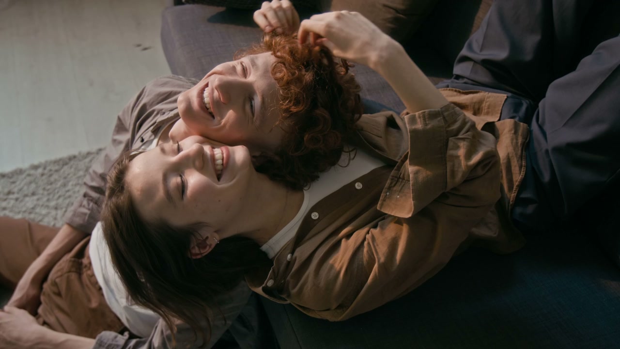Romantic Couple Cuddling on Sofa