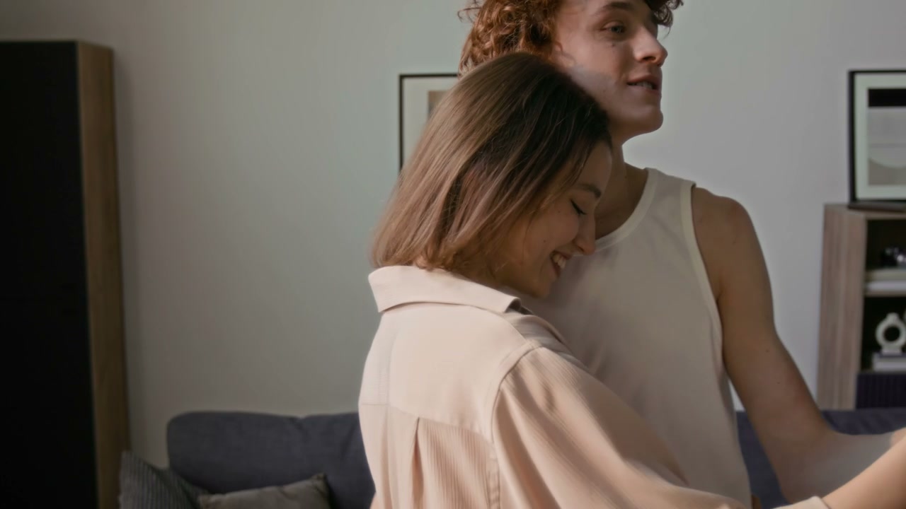 Romantic Couple Dancing and Embracing at Home