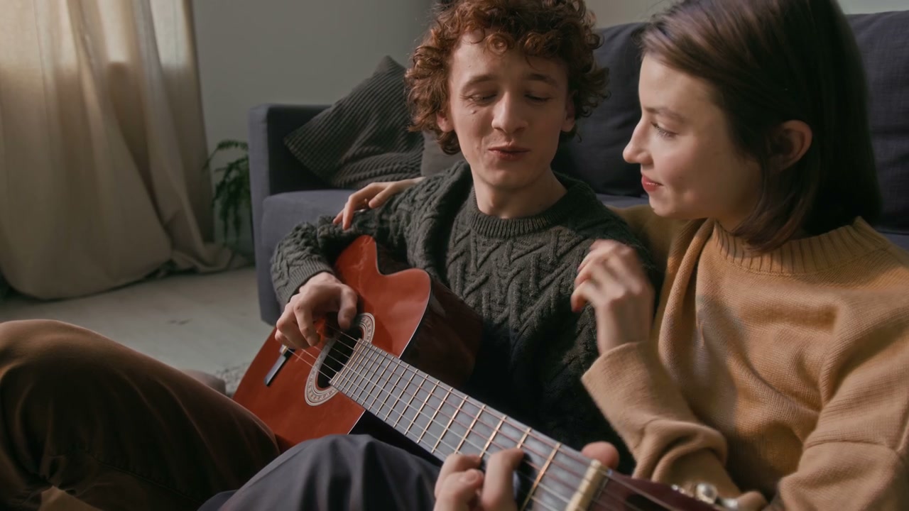 Romantic Couple Playing Guitar and Singing
