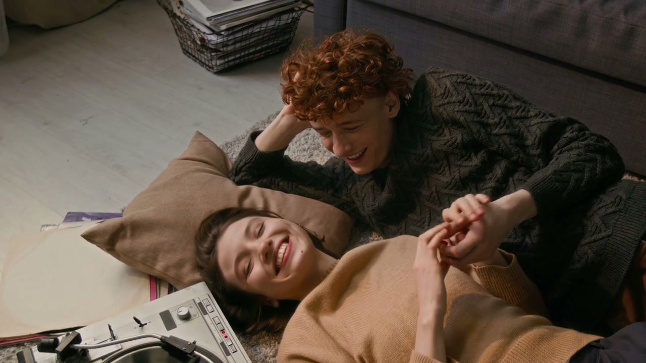 Romantic Couple Listening to Vinyl Music