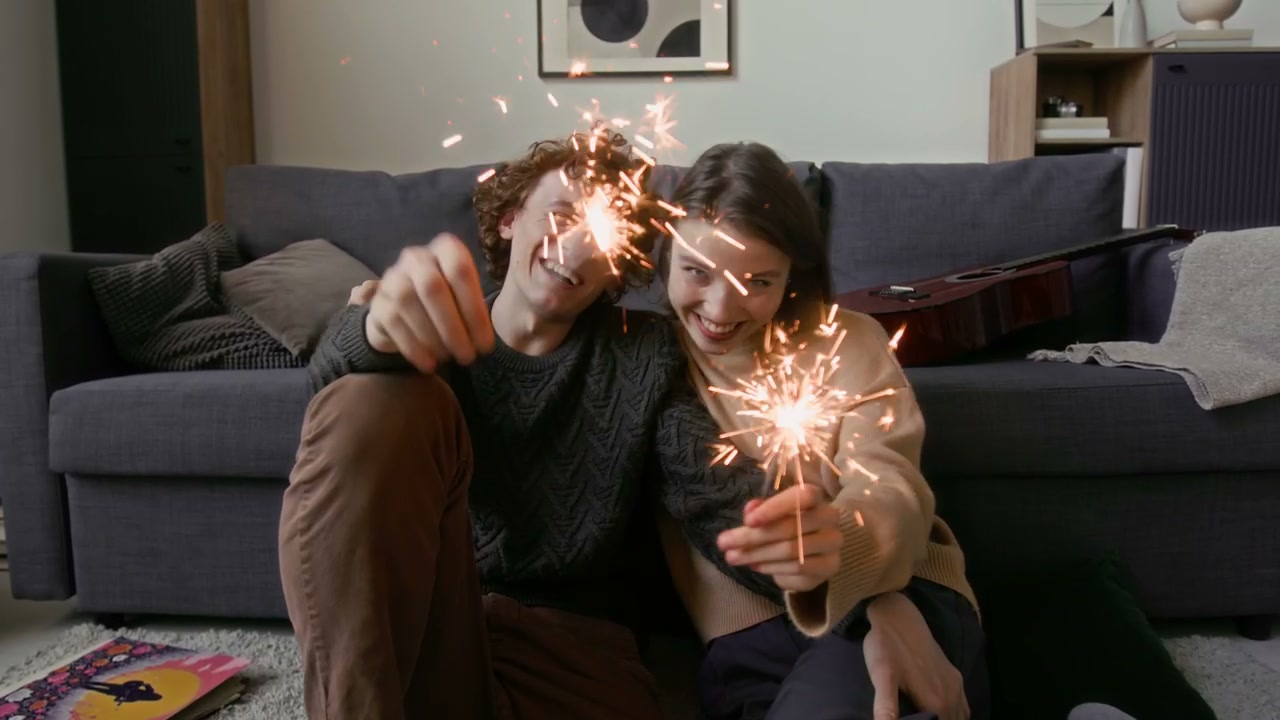 Happy Couple Holding Sparklers