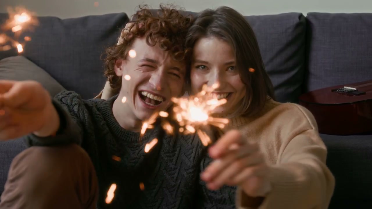 Happy Couple with Sparklers at Home