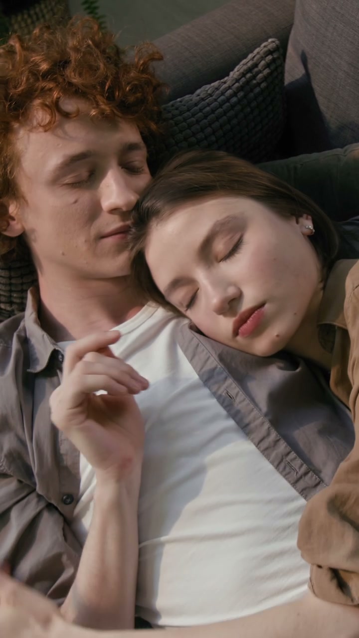 Romantic Couple Cuddling on Sofa