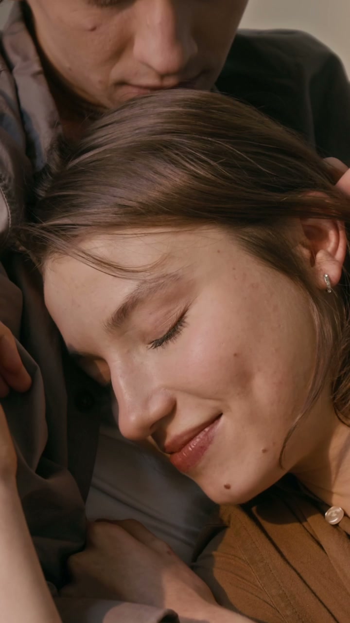 Man Kisses Woman's Forehead