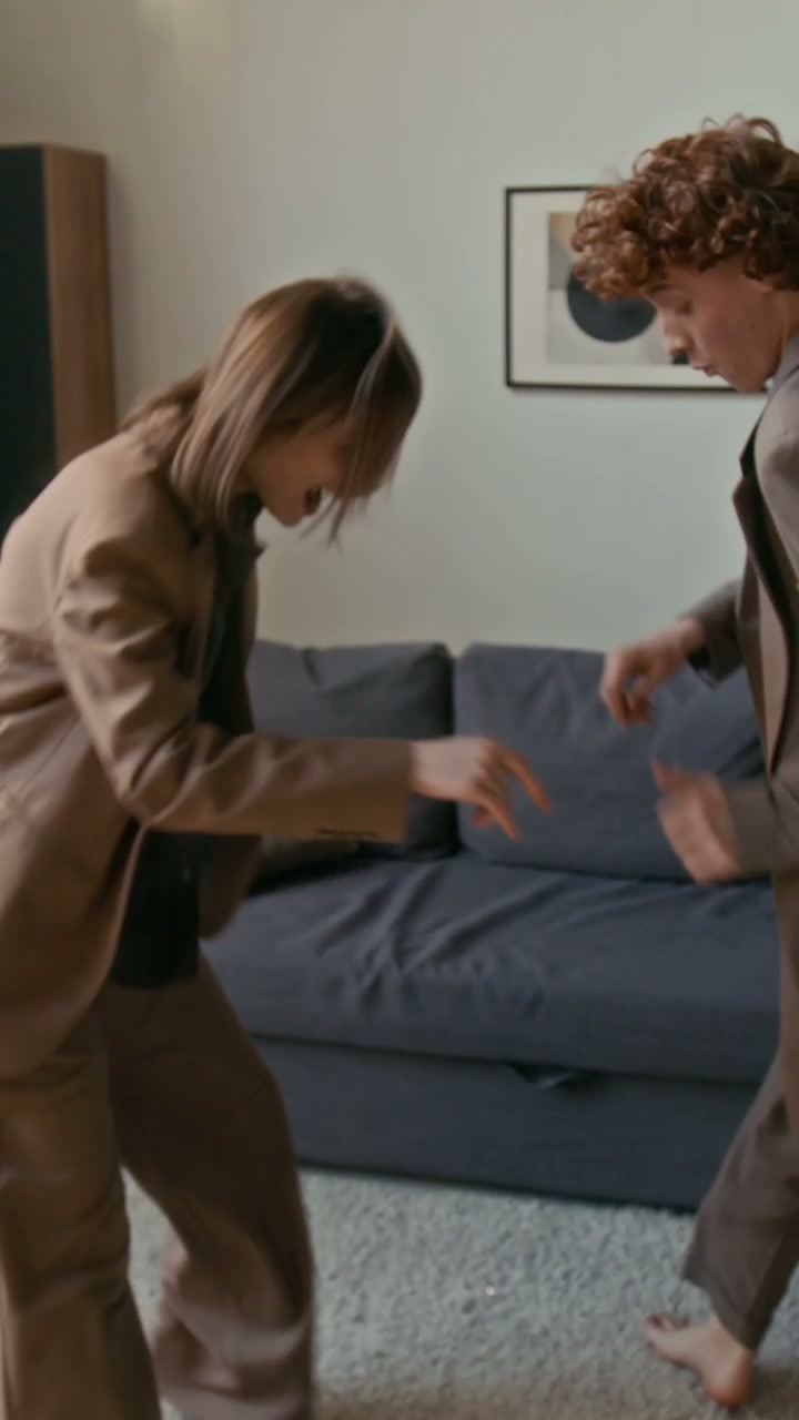 Romantic Couple in Suits Dancing at Home