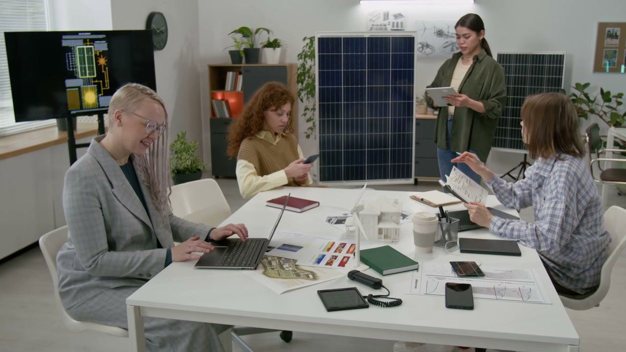 Women Discussing Solar Panel Technology