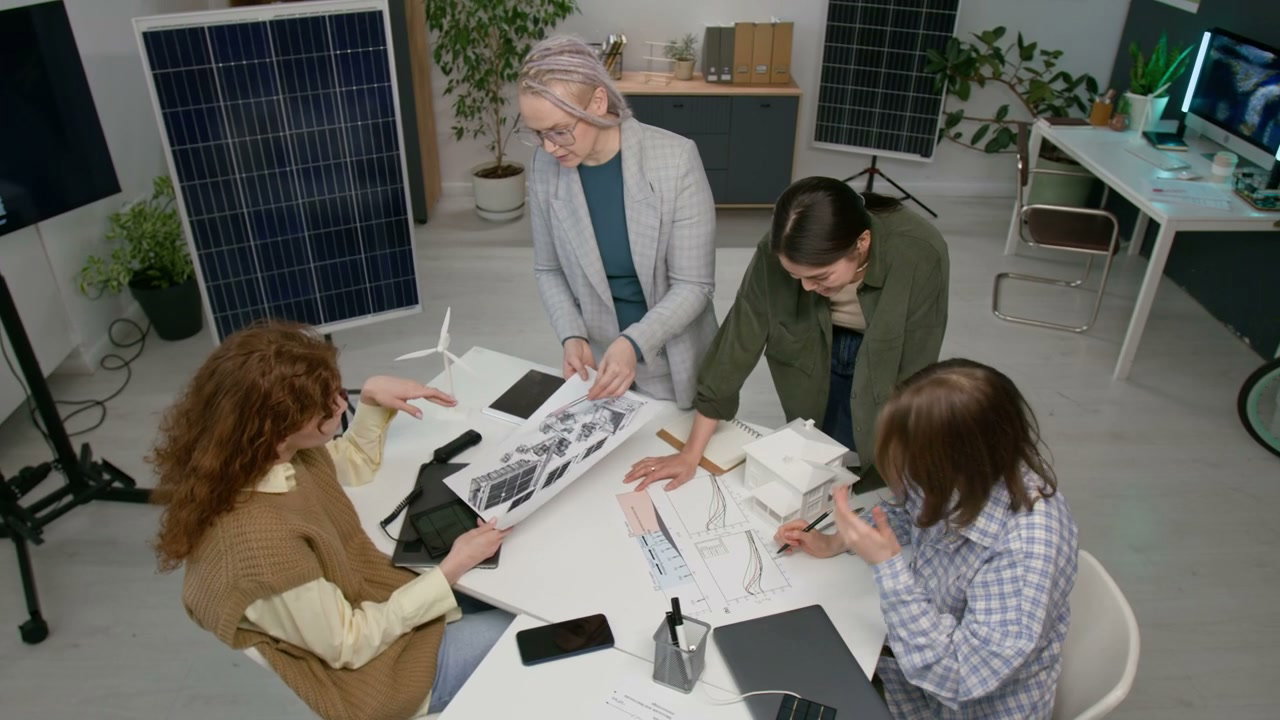 Women Engineers Discussing Solar Energy Plans