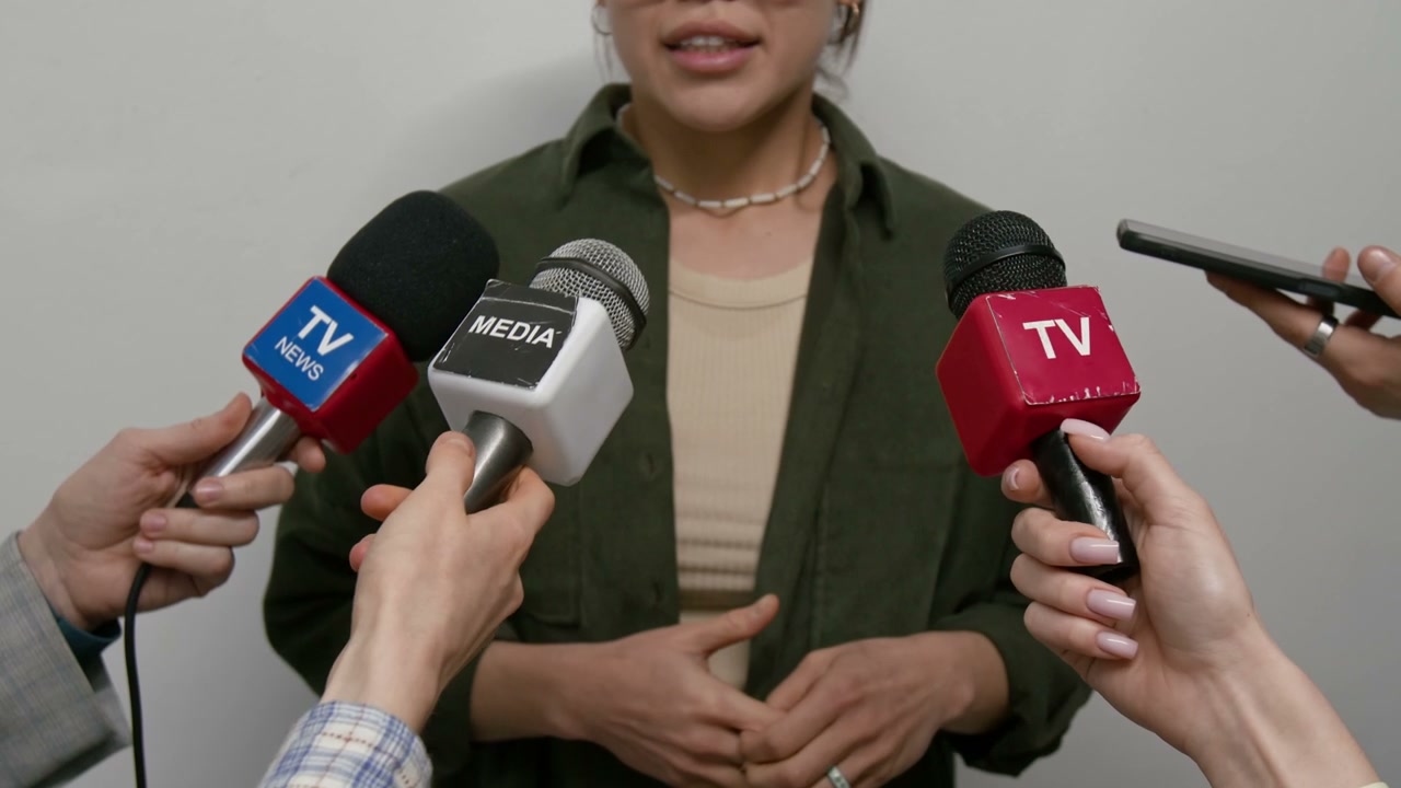 Woman Speaking at Press Conference