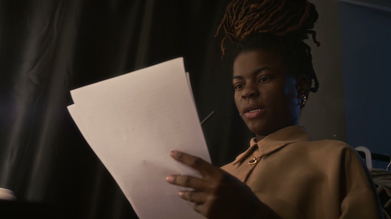Woman Rehearsing Script for Stand-Up Comedy
