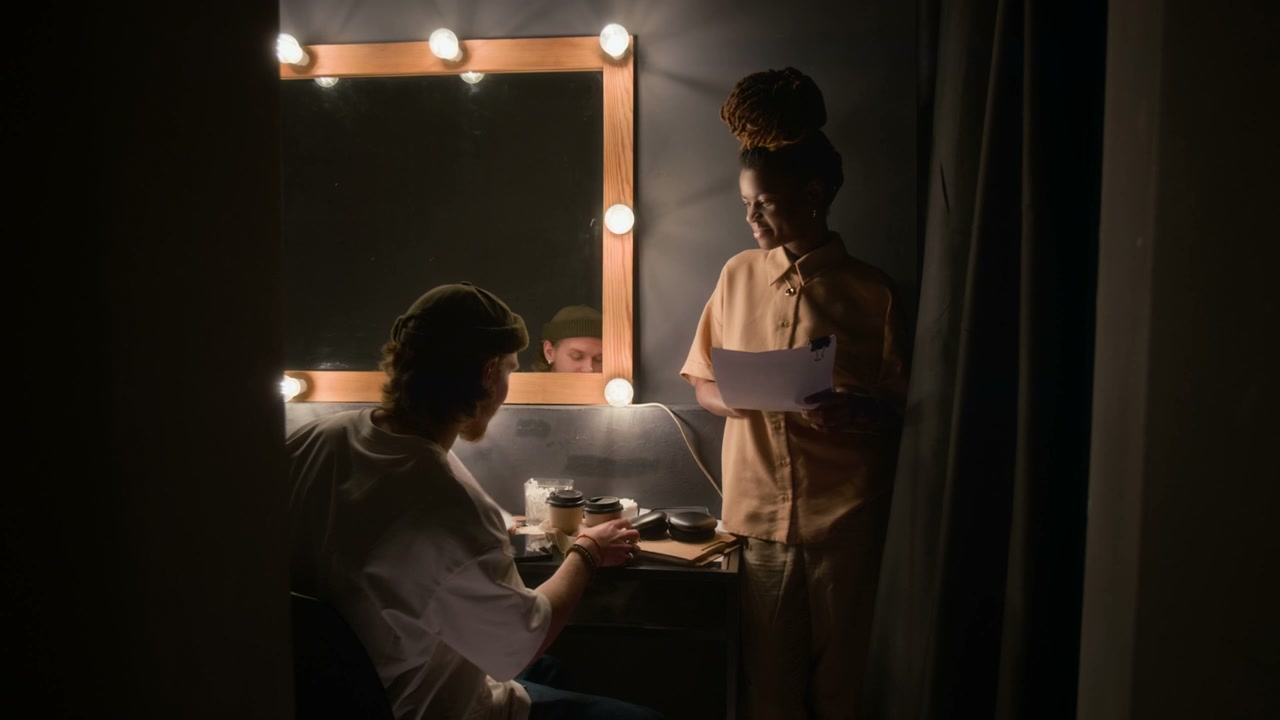 Comedians Prepping Backstage with Notes