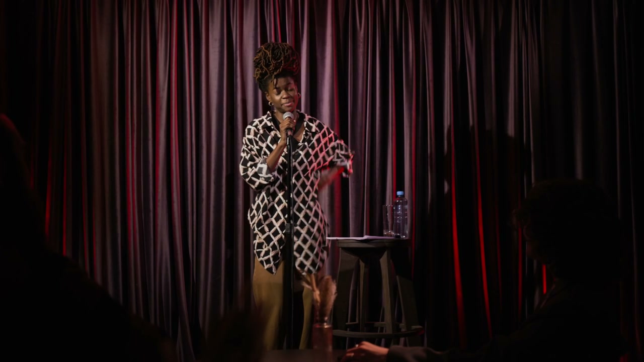 Comedian Performing Stand Up On Stage
