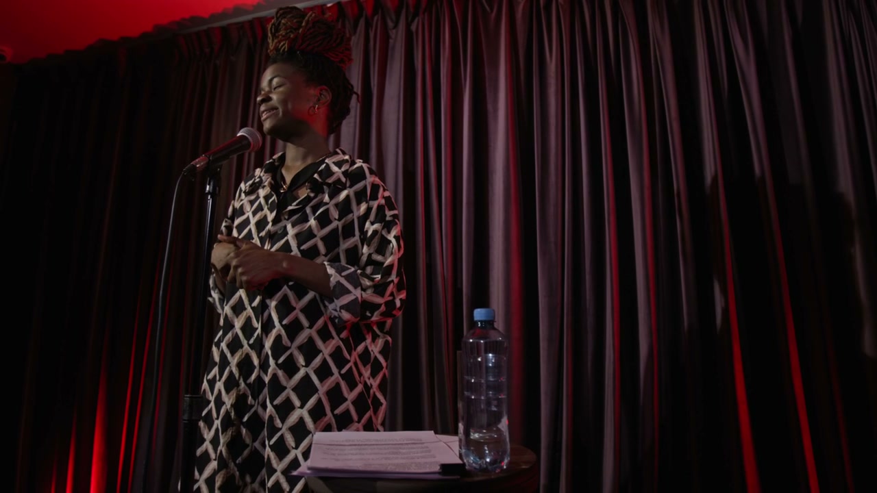 Woman Performing Stand-Up Comedy on Stage