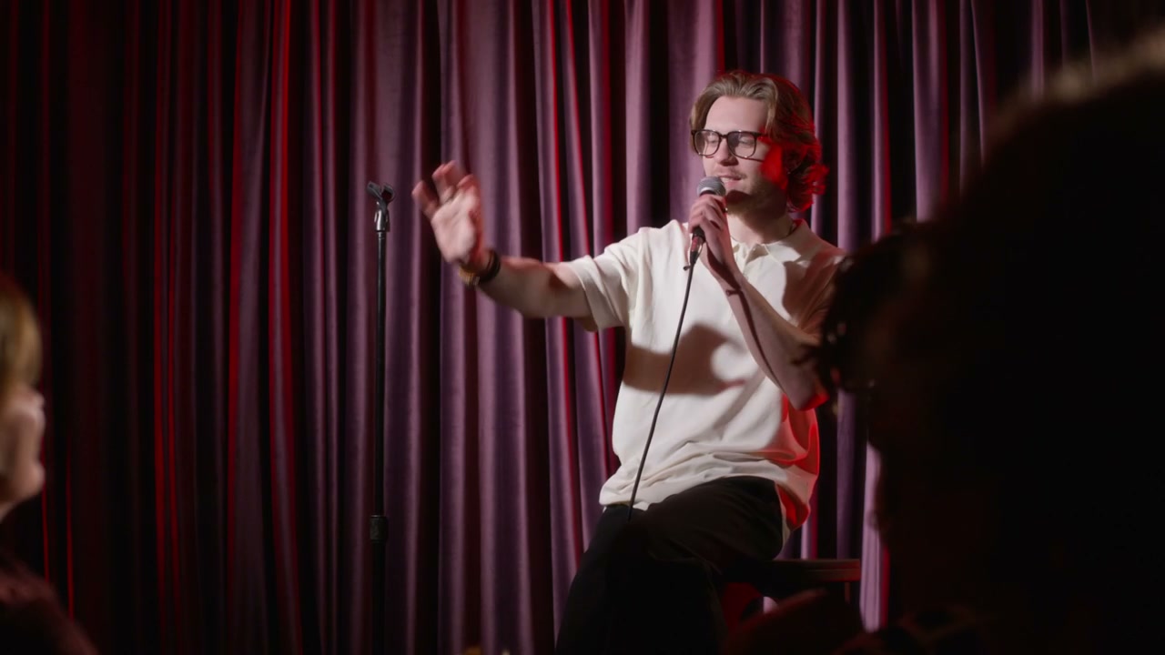 Comedian Performing Stand-Up on Stage