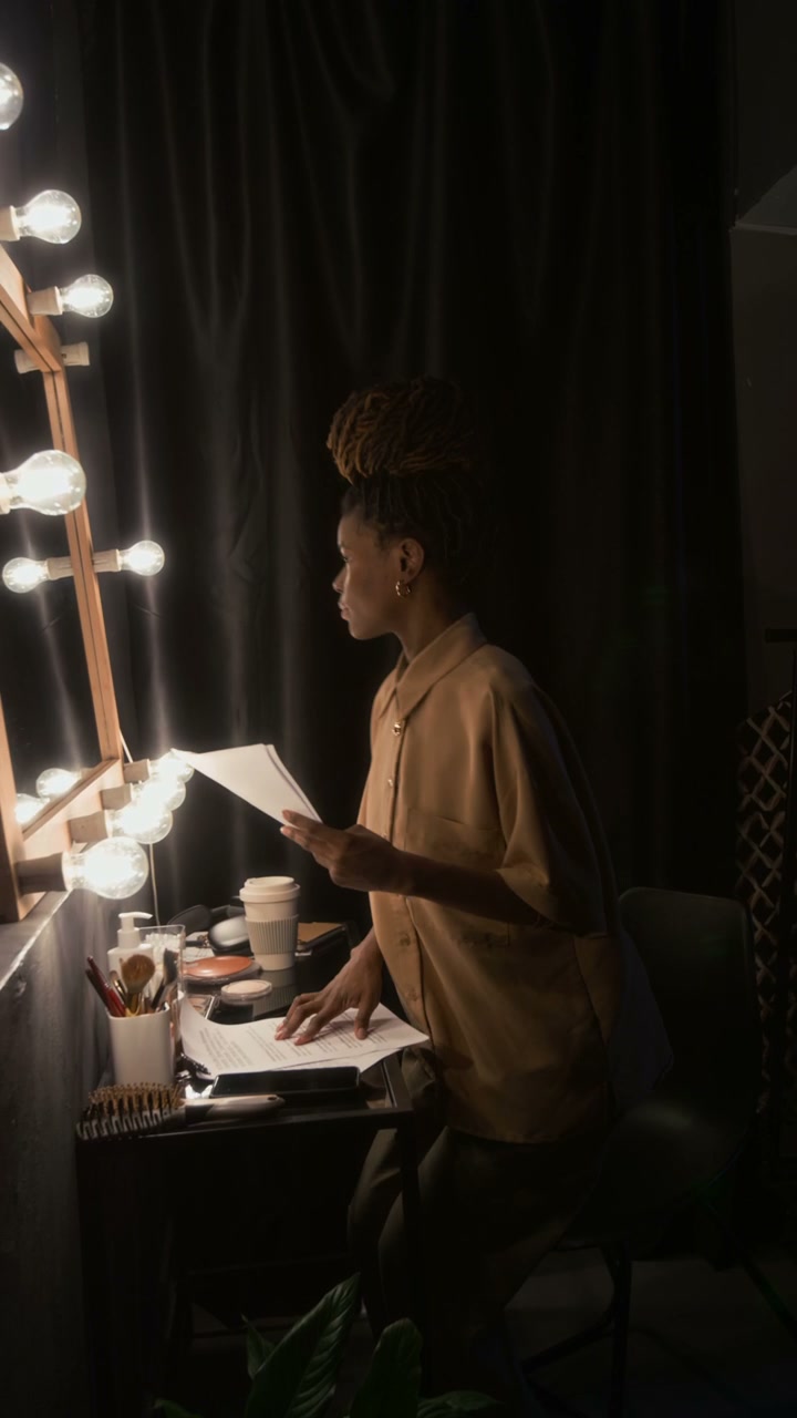 Comedian Preparing Backstage in Dressing Room