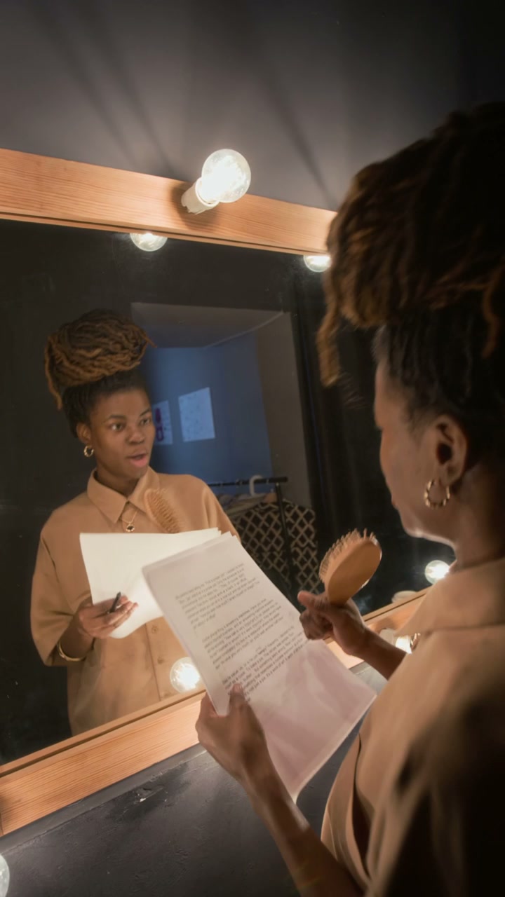 Comedian Rehearsing in Dressing Room Mirror