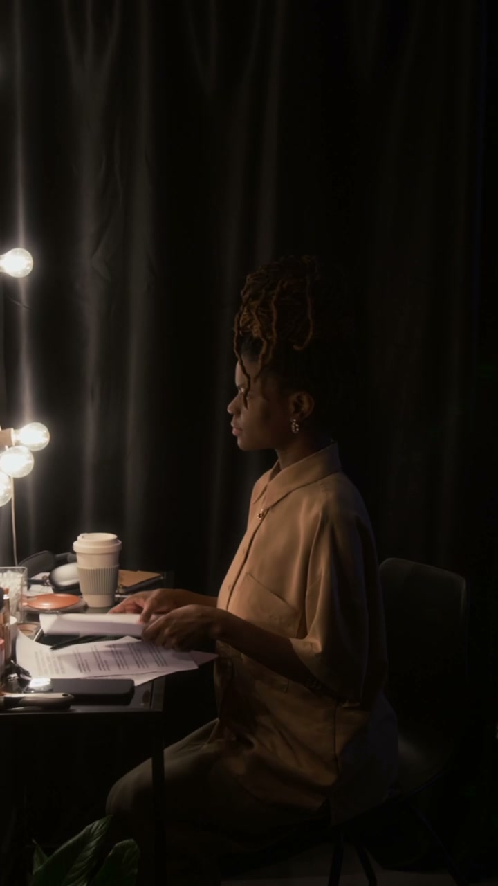 Comedian Preparing Backstage with Script