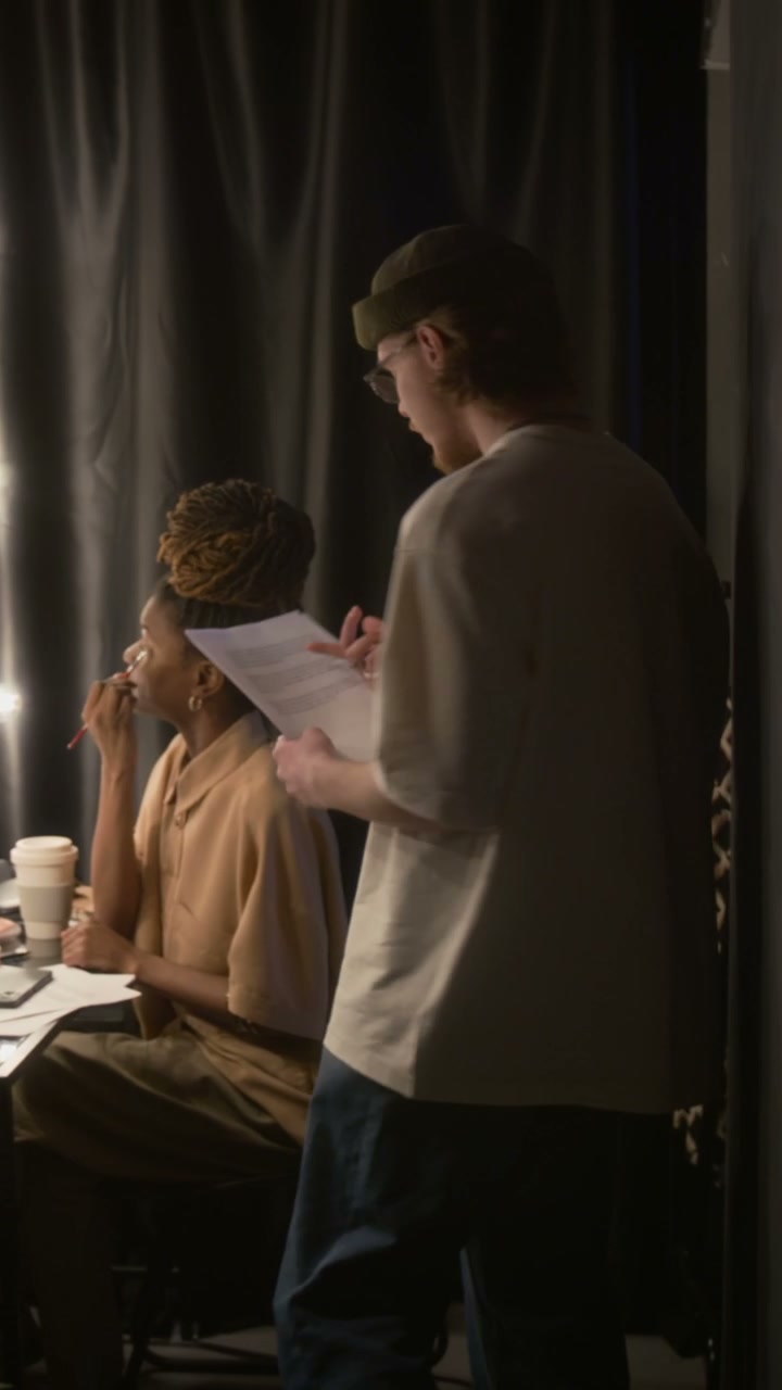 Performers Rehearsing Script Backstage