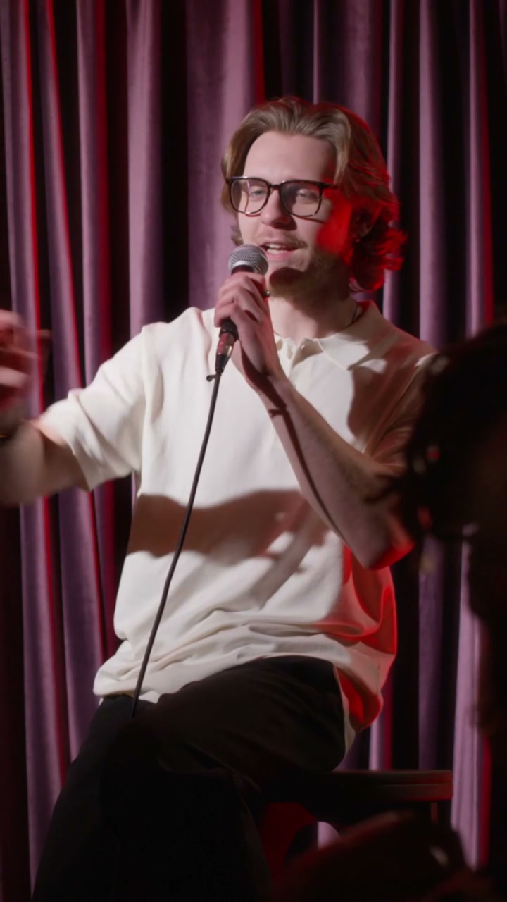 Comedian Performing Stand-Up Comedy on Stage