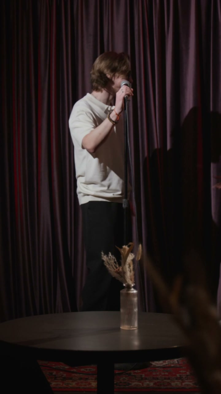 Performers Hugging on Stand-Up Stage