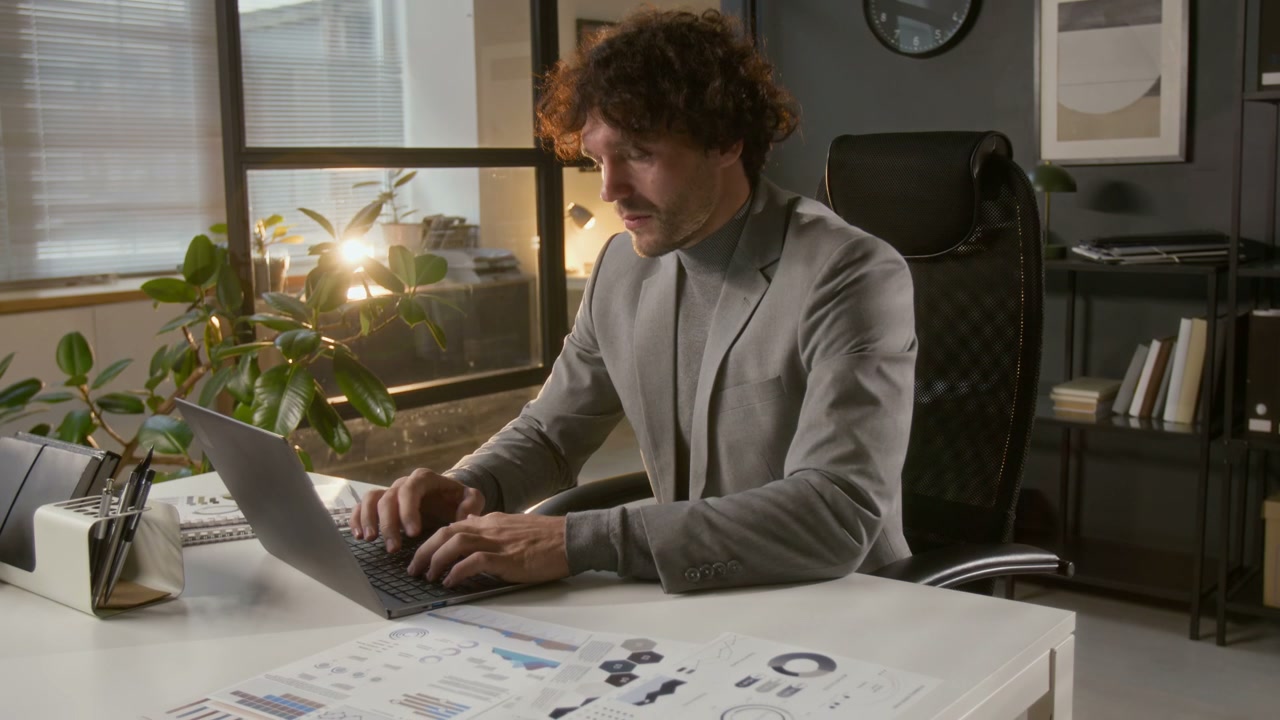 Focused Businessman Working on Laptop