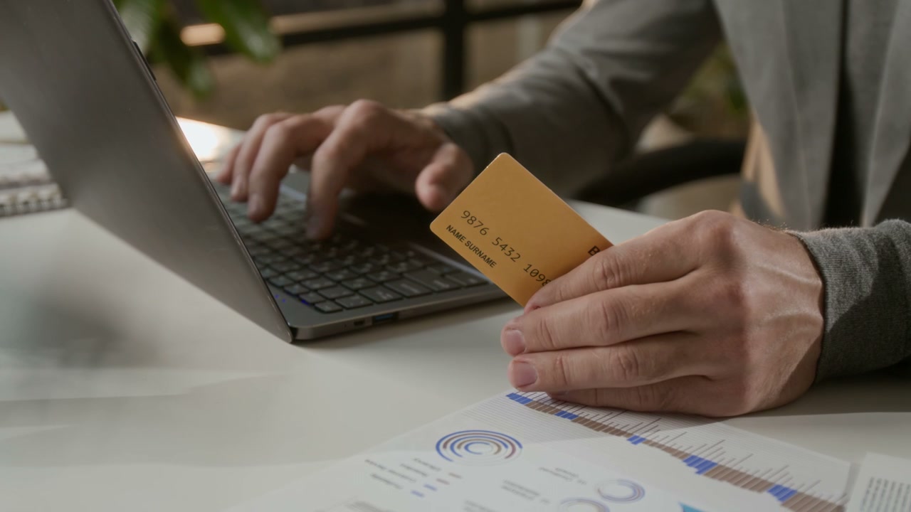 Close-up of Hands Typing on Laptop for Online Payment
