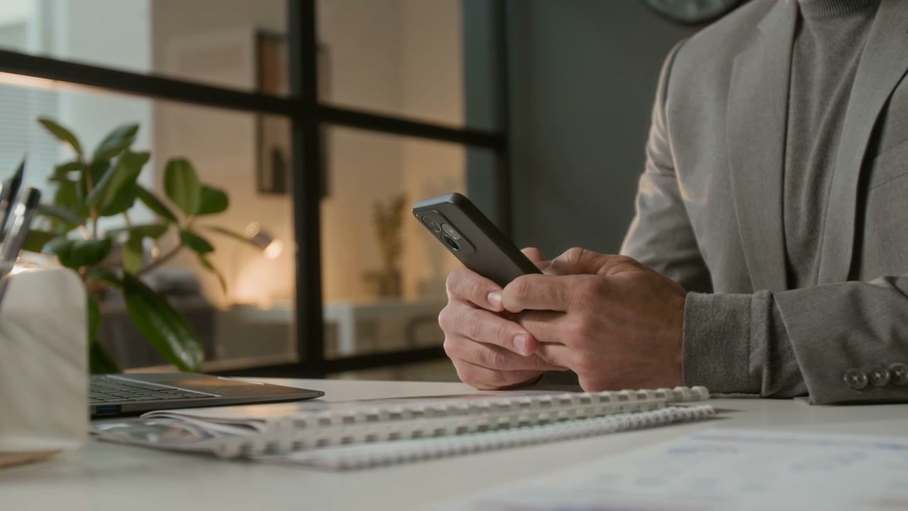 Close Up of Businessman Using Smartphone