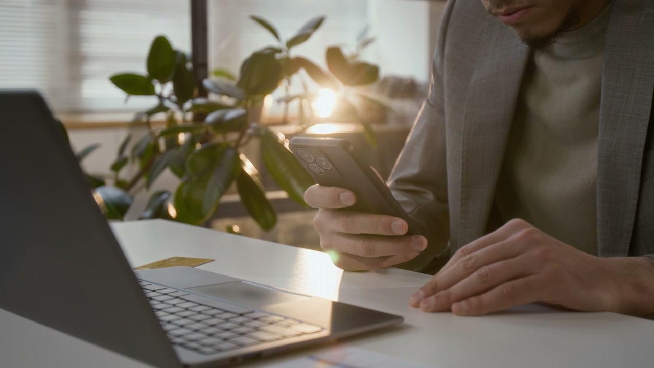 Businessman Using Smartphone in Office