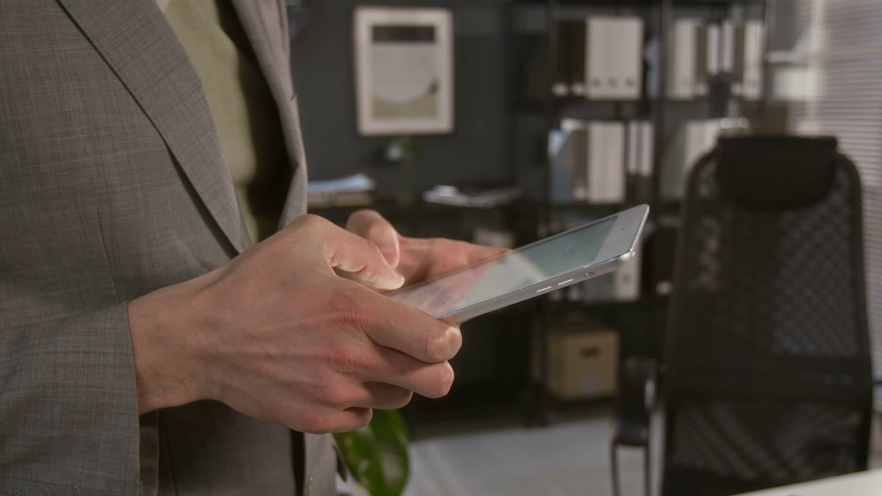 Businessman Using Digital Tablet in Office