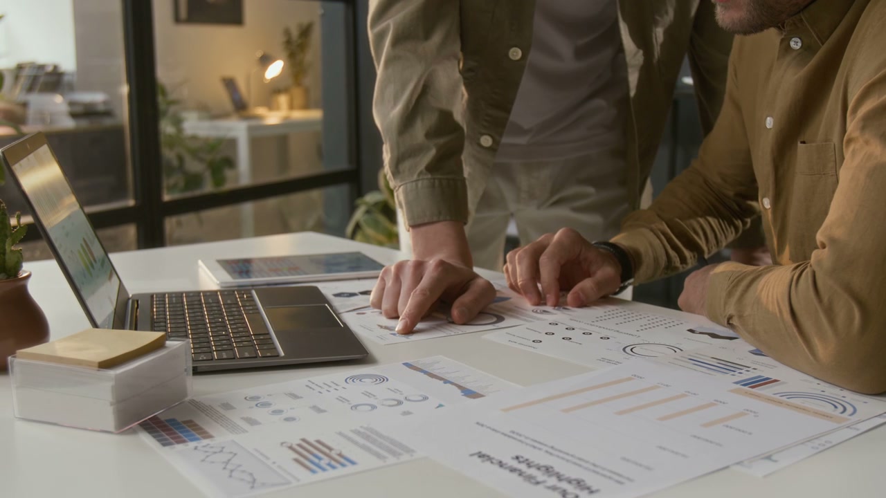 Business Professionals Discussing Data in Office
