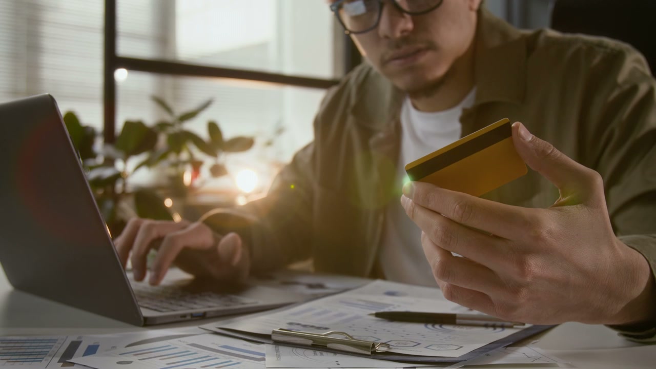 Man Making Online Payment with Laptop