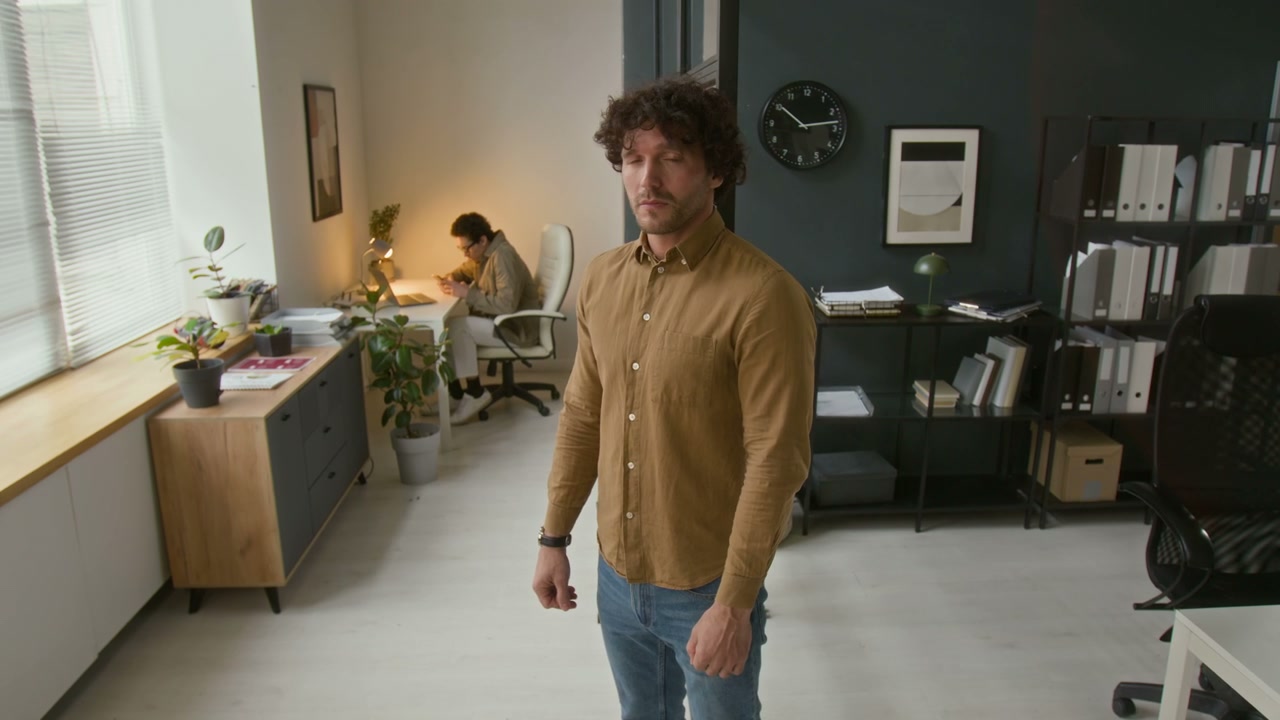Confident Businessman Posing in Office
