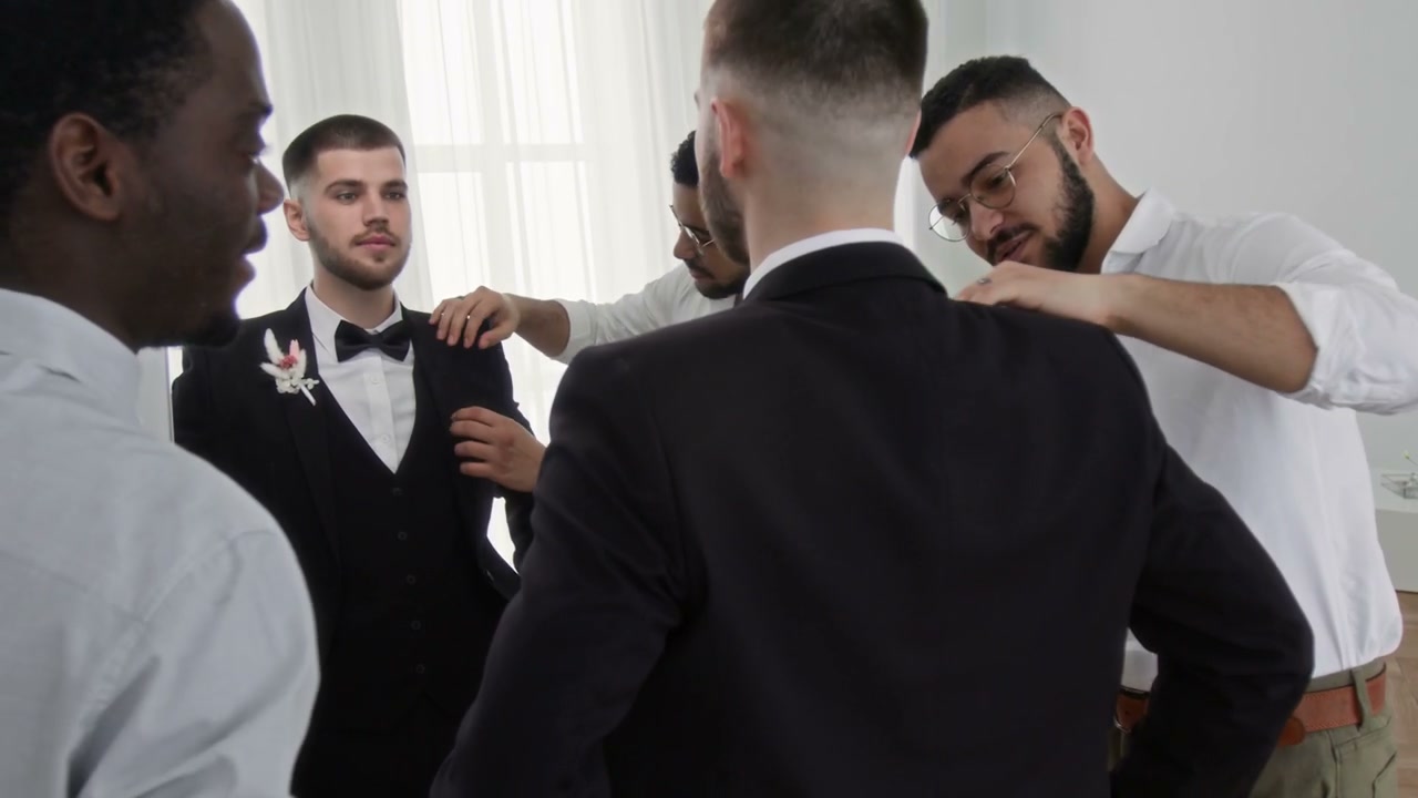 Groom and Groomsmen Preparing for Wedding Day