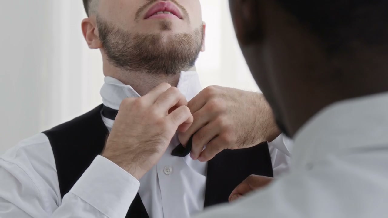 Groom Getting Ready with Groomsmen
