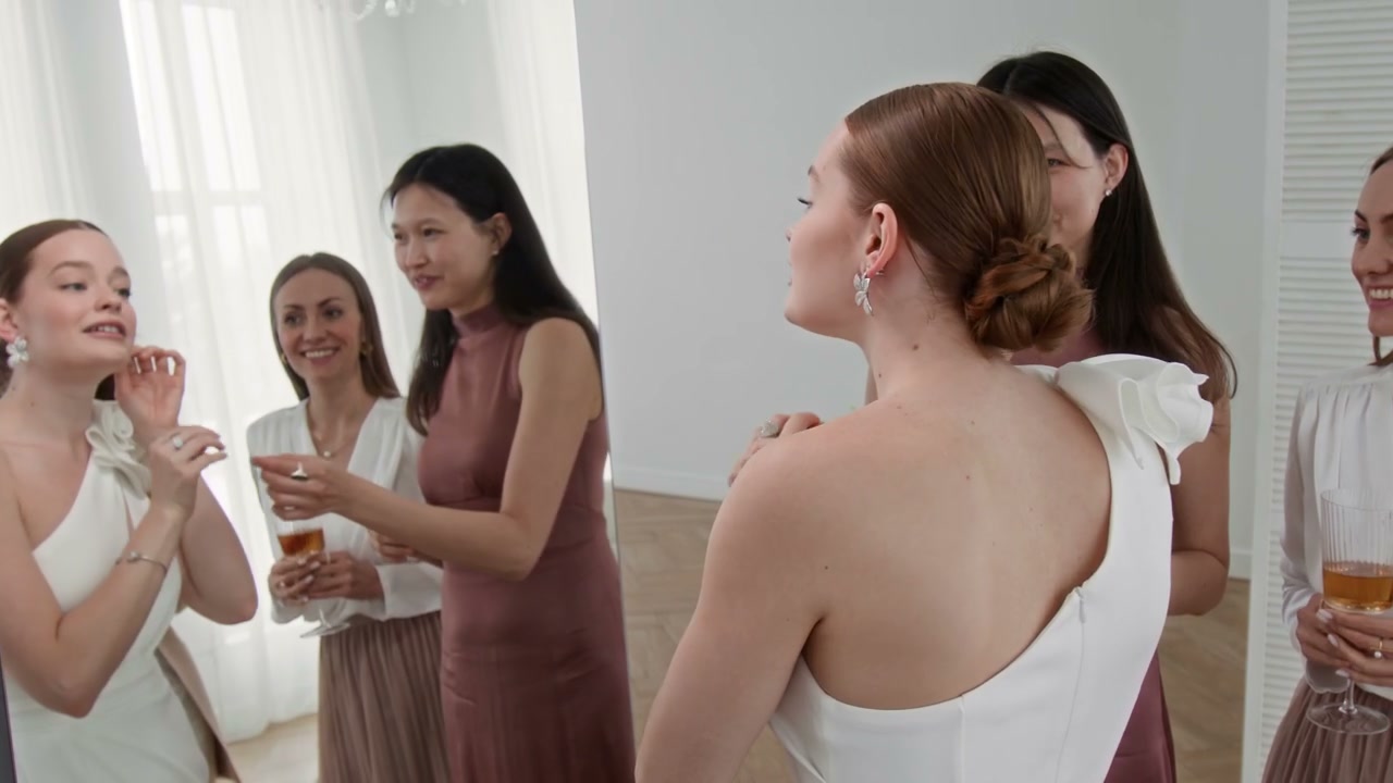 Bride Trying on Earrings with Friends