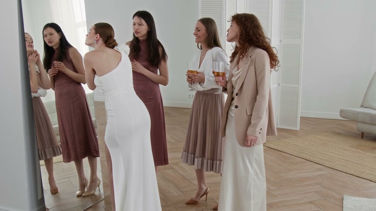 Bride Posing in Wedding Dress with Friends