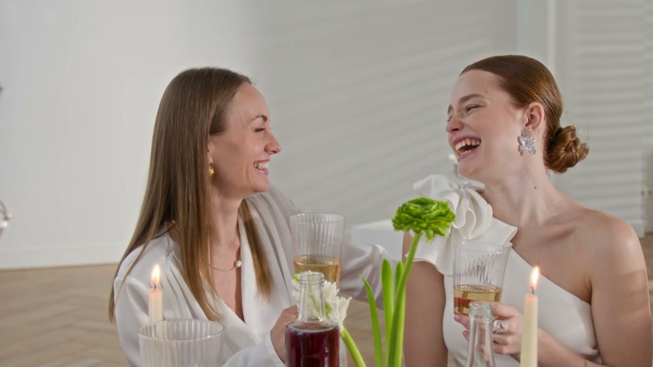 Joyful Women Toasting at Wedding Dinner